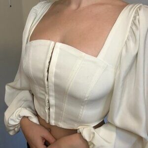 White long sleeved corset top from Urban Outfitters